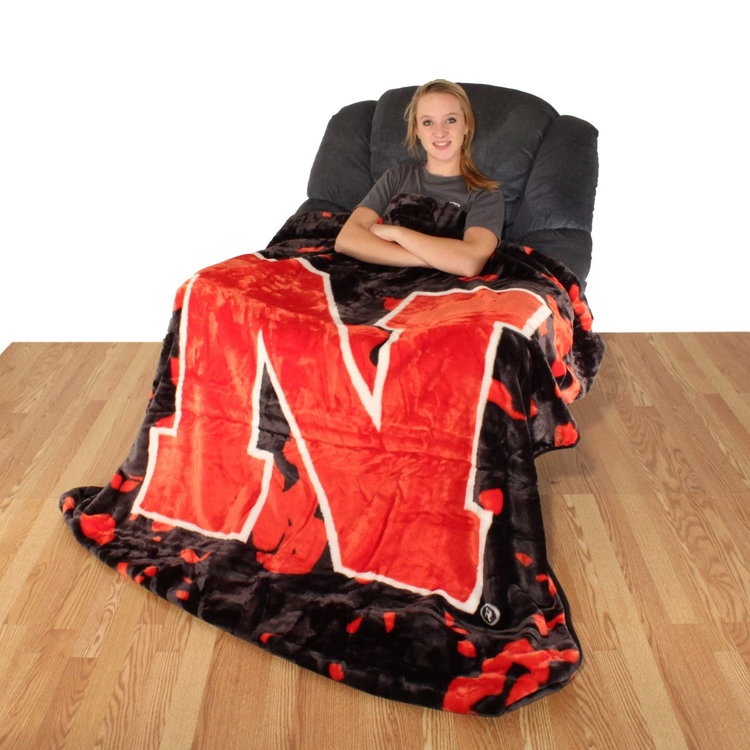 86"x63" NCAA Cornhuskers Throw Blanket Sports Football Bedspread Team Logo - Diamond Home USA