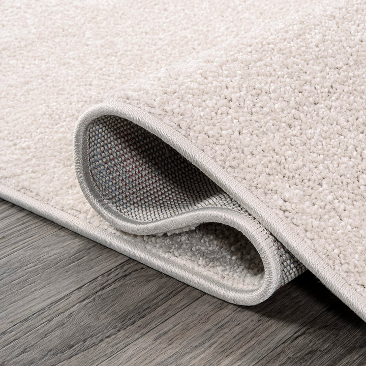 JONATHAN Y Tumbling Solid Low-Pile Area Rug